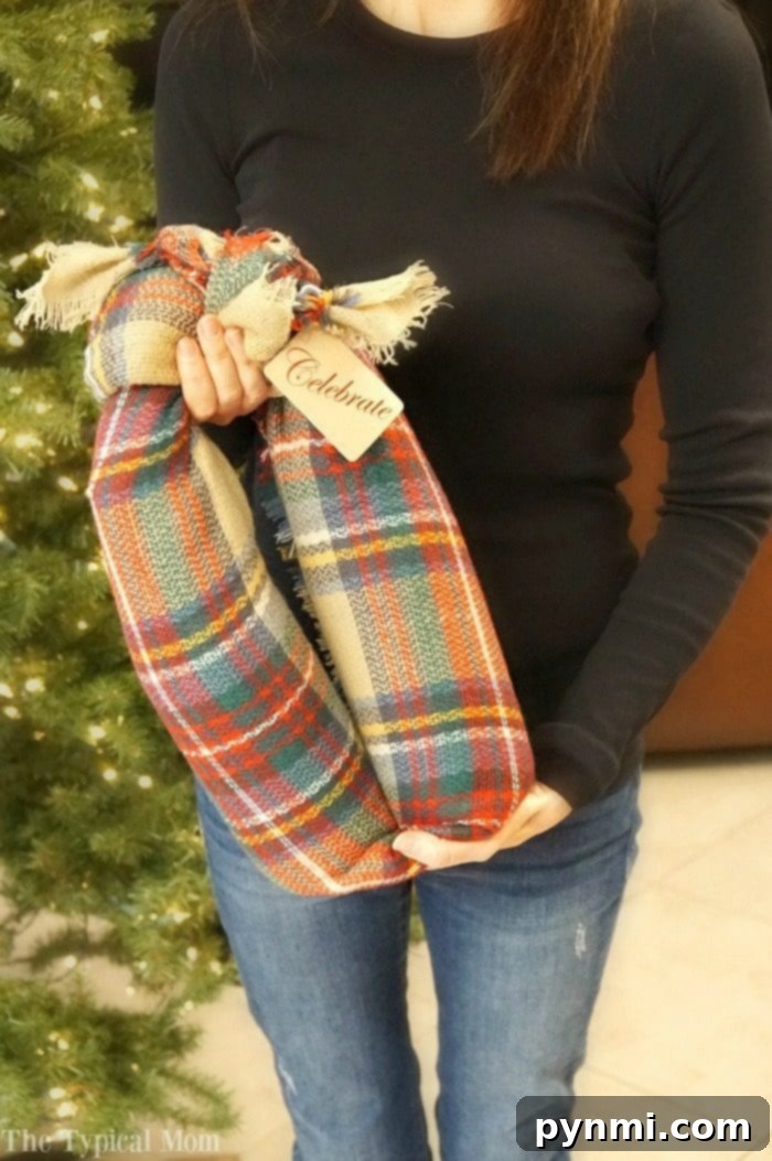 Showcasing elegant wine gifting ideas, specifically wrapping two bottles in a stylish scarf, for a fun and useful present.