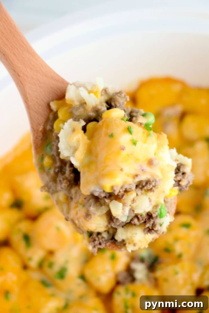 A delicious Crock Pot Tater Tot Casserole, cheesy and golden brown, perfect for a comforting family meal.