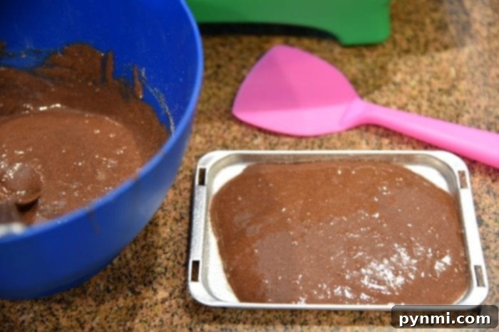 Two homemade Easy Bake Oven cakes cooling on a rack