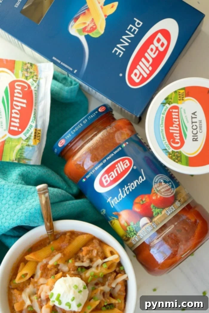 Effortless Instant Pot Lasagna Soup 4 Ingredients for Instant Pot Lasagna Soup: Barilla penne, Barilla Traditional pasta sauce, Galbani ricotta cheese, and Galbani mozzarella cheese alongside a prepared bowl of soup.