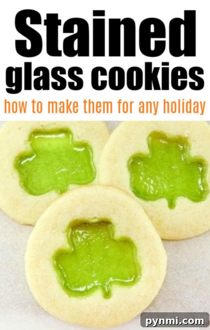 Crafting Edible Gems: Stained Glass Cookies 4 A trio of freshly baked stained glass shamrock cookies, beautifully arranged to highlight their vibrant green centers.