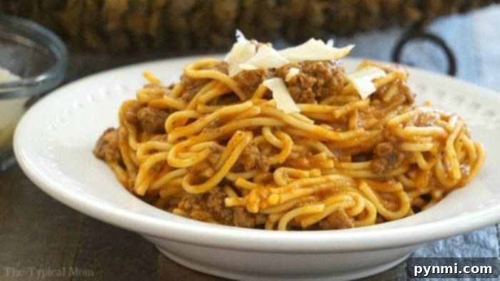 Easy 10 minute Instant Pot spaghetti recipe that's one of our favorite one pot meals ever! A family favorite dinner that you just dump and go and only requires a few ingredients to make. A complete pasta dish that feeds all five of us for under ten dollars, that's a big win in my book! #instantpot #pressurecooker #spaghetti #intantpotrecipes #instantpotspaghetti #pasta #dump #dinner #crockpotexpress Instant Pot spaghetti recipe served in a pan