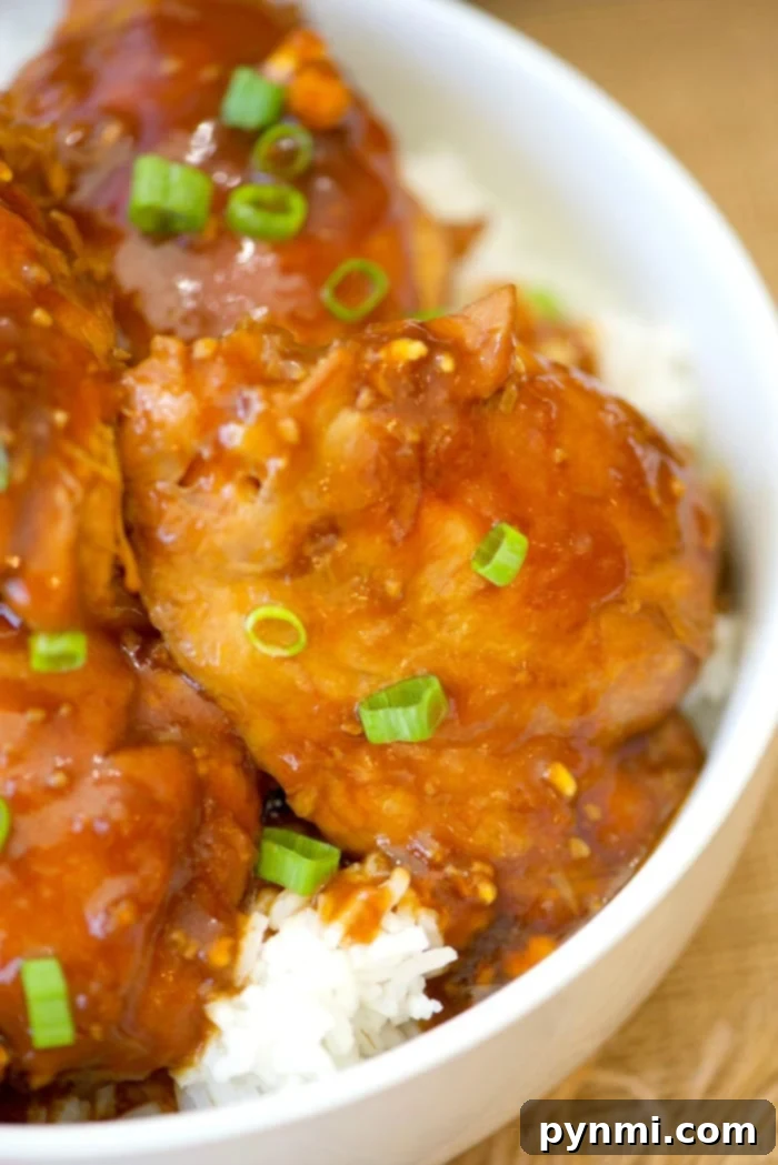 This homemade Instant Pot Teriyaki Chicken recipe delivers mouth-watering tenderness and rich flavor in a snap. Perfect for a quick, healthy family dinner. Homemade Instant Pot teriyaki chicken thighs, garnished.