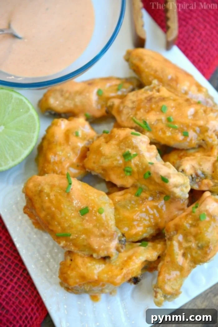 Sweet Sriracha Baked Chicken Wings – perfectly glazed, crispy skin, ready to serve as the ultimate appetizer.