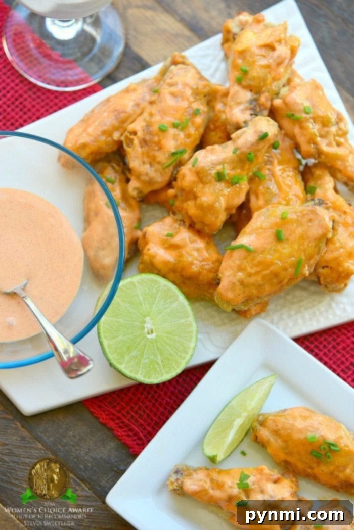 A generous platter of glazed sweet Sriracha baked chicken wings, perfectly crispy and ready for sharing.