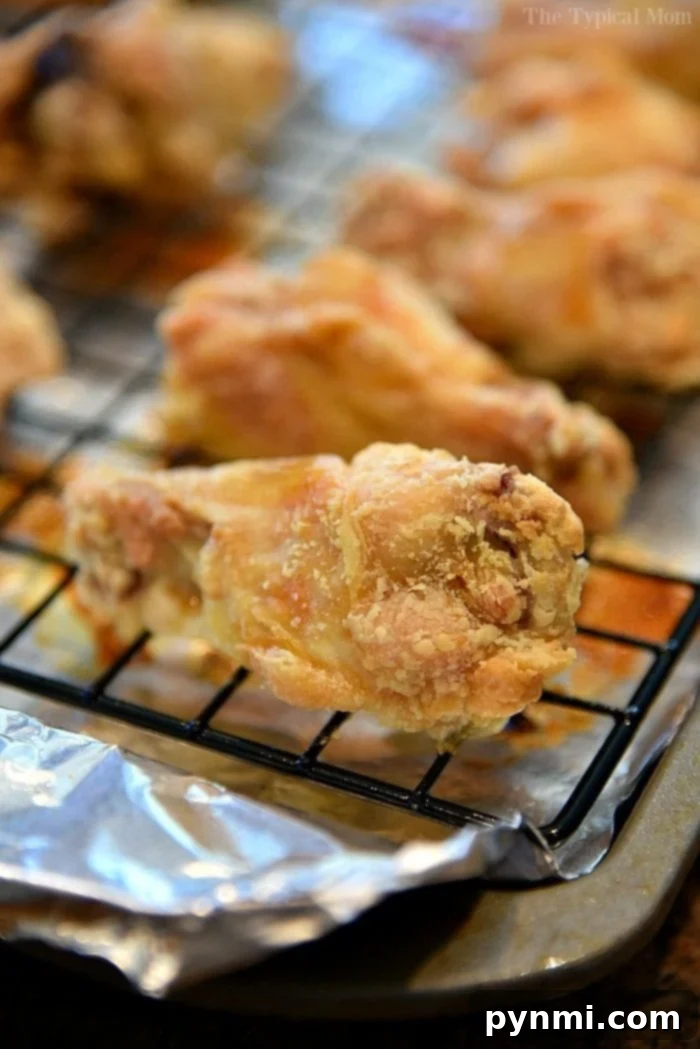 Achieve Crispy Baked Wings: The 425 Method 2 Close-up of golden brown crispy chicken wings baked in the oven, served as a perfect appetizer
