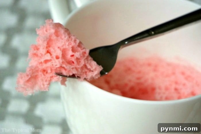 Strawberry cake in a mug recipe that uses just 3 ingredients and takes just 1 minute in the microwave! So moist, it's the perfect dessert for one! #mugcake #cake #microwave #dessert #strawberry #angelfoodcake cake in a mug