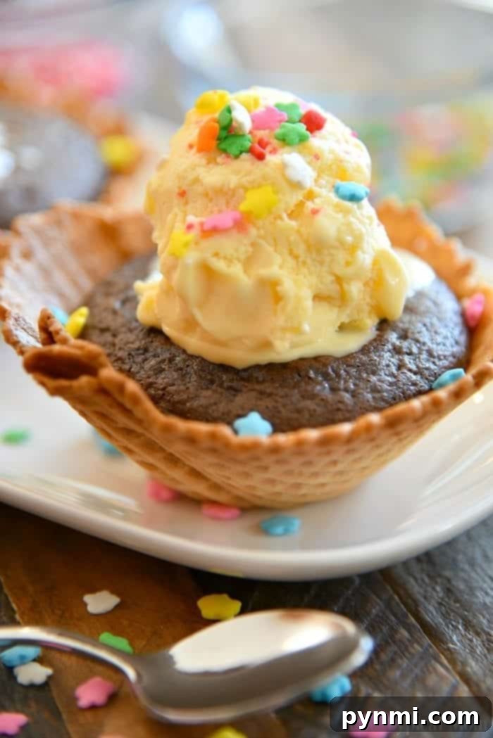 Delicious cupcakes baked in crisp waffle bowls, ready to be transformed into festive sundae cupcakes, perfect for any birthday party dessert bar.