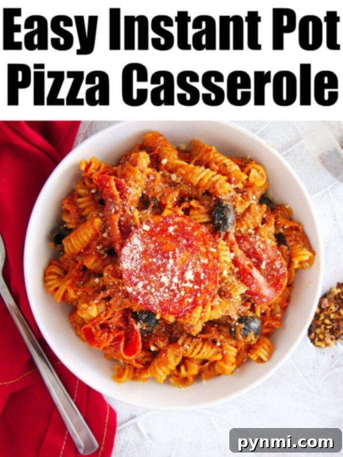 Instant Pot pizza casserole is great! Super easy to dump it all in your pressure cooker and put in all of your favorite pizza toppings. #instantpotpizzapasta #instantpot #pizza #pasta #dinner #instantpotrecipes #thetypicalmom #pizzapasta A large pot of Instant Pot pizza casserole, rich with sauce, melted cheese, and pepperoni, ready for serving.