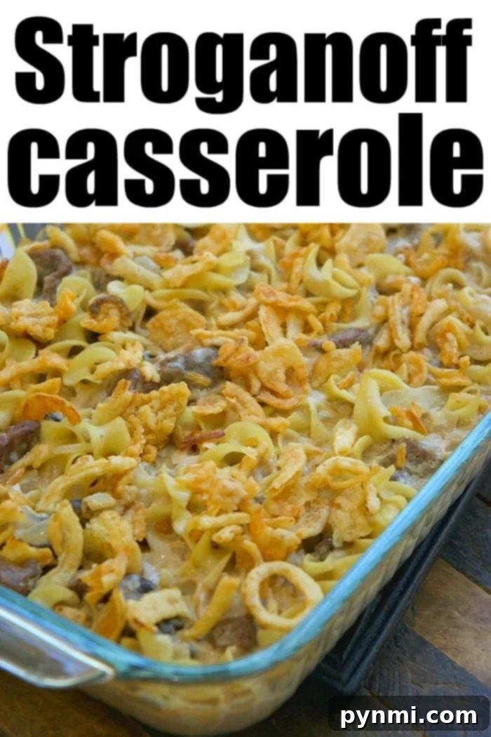 Hearty beef stroganoff casserole, creamy and comforting, baked with egg noodles and a crispy onion topping.