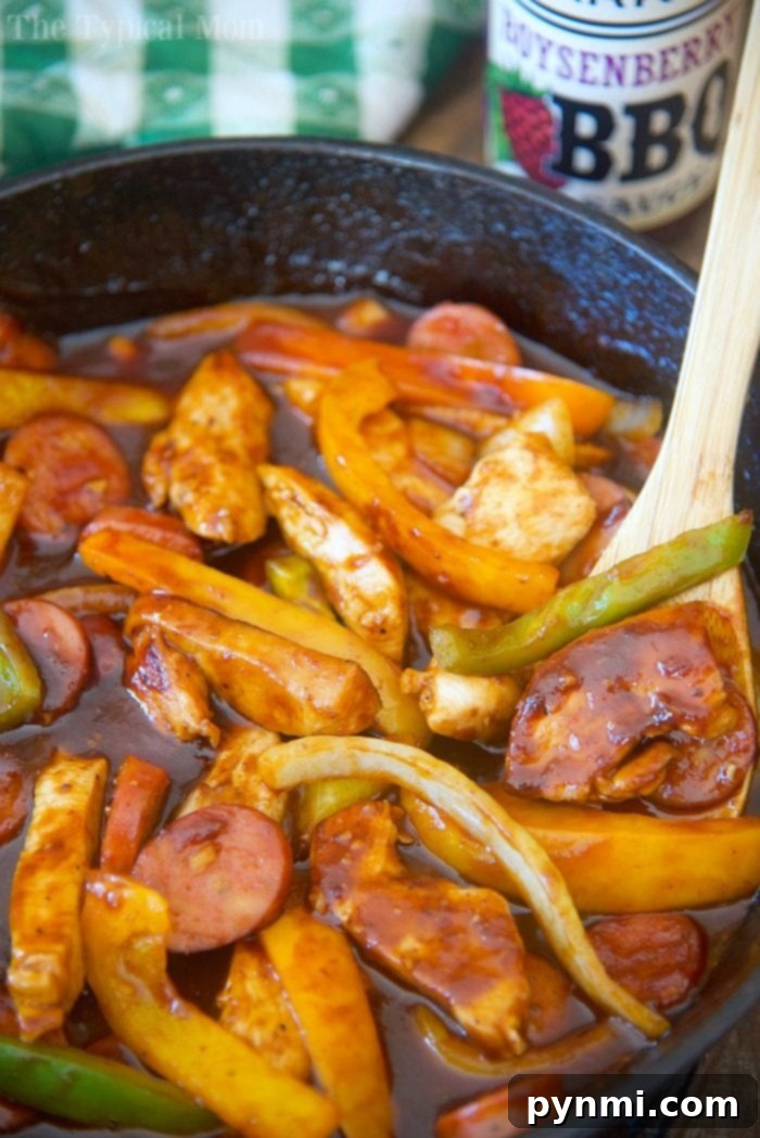 A savory and sweet Boysenberry Chicken and Sausage skillet meal, inspired by the flavors of Knott's Berry Farm. Homemade Boysenberry Chicken and Sausage skillet meal