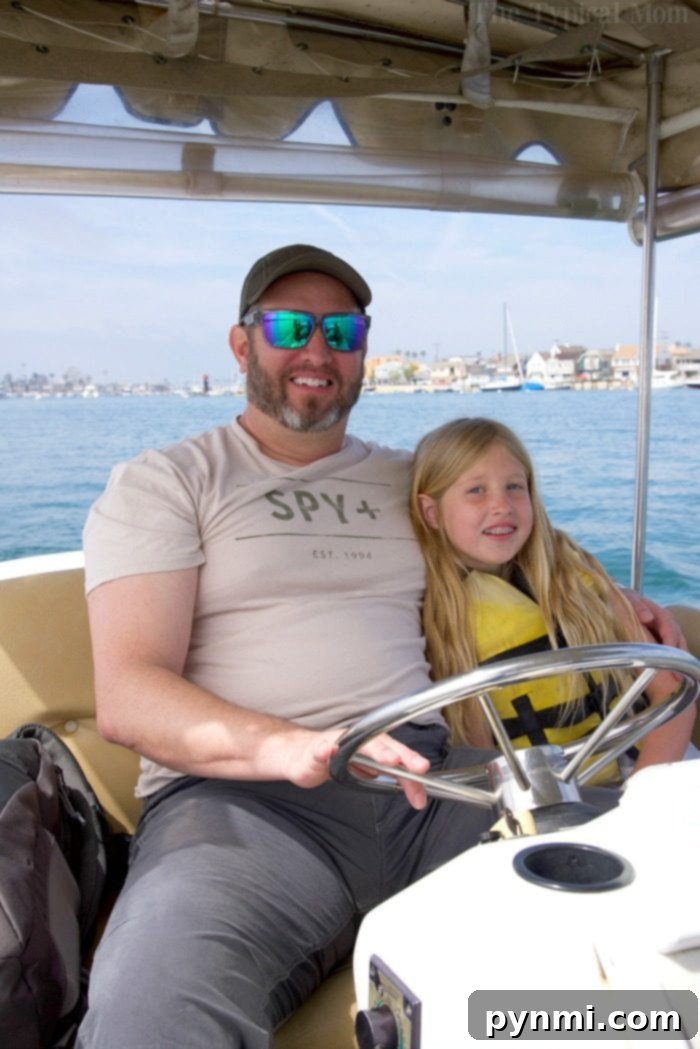 Family enjoying a boat rental on Newport Beach waters