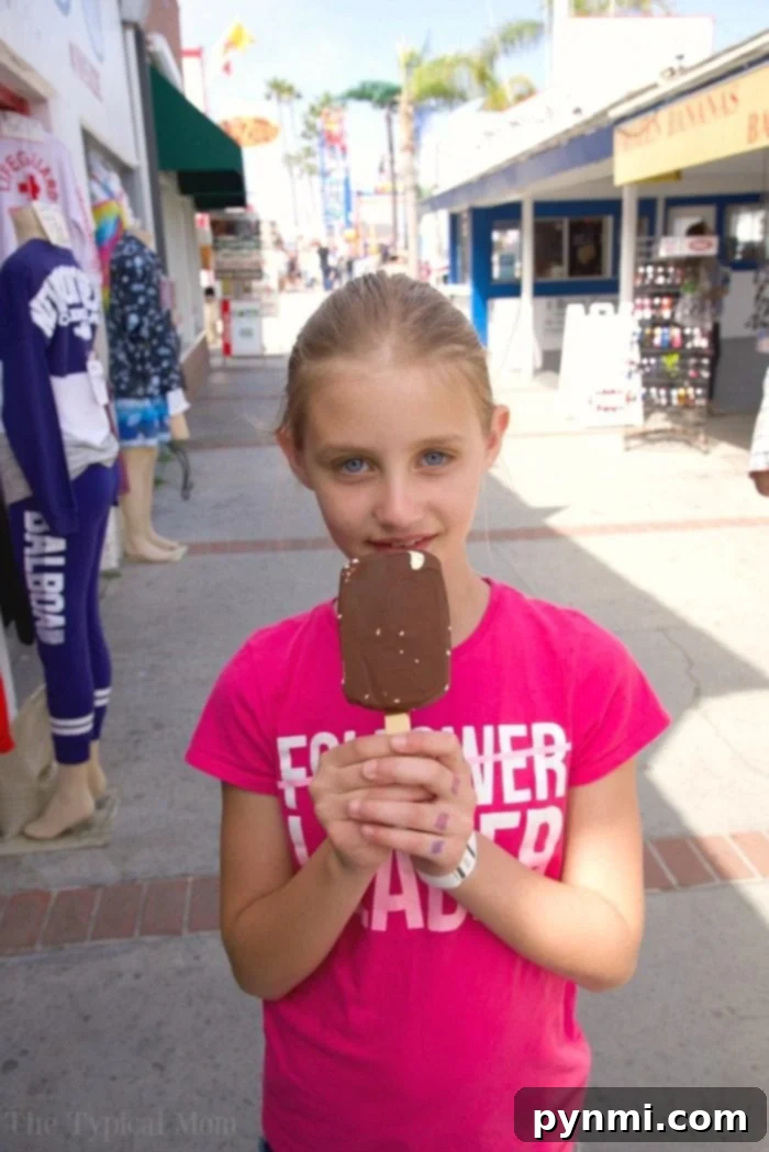 Person enjoying a nostalgic treat at Balboa Fun Zone