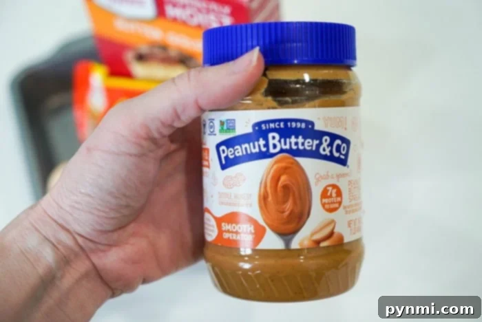 Pressure Perfect Brownies 3 A spoonful of creamy peanut butter, ready to be incorporated into a delicious dessert.