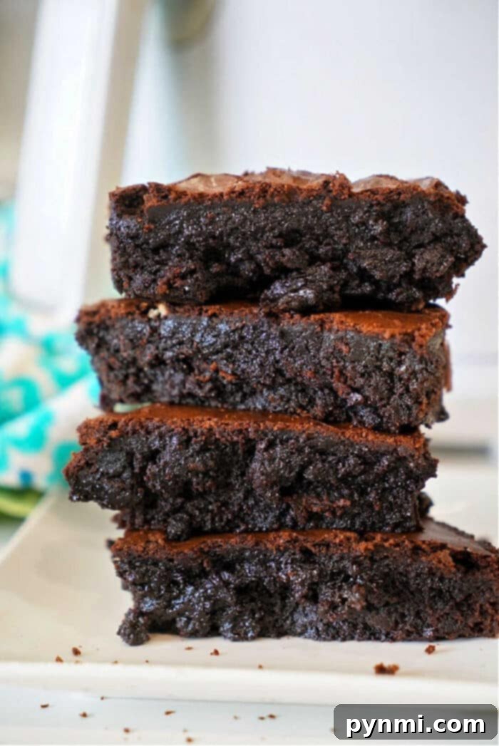 Make brownies out of cake mix easily with just 2 ingredients and any flavor of cake mix you like! Rich and chewy strawberry brownies are our favorite but try lemon cake mix brownies too. A quick dessert your kids will love and cheap to make for a bunch of people #cakemix #brownies #strawberry #lemon #cakemixbrownies Delightful cake mix brownies, easily made with minimal ingredients and customizable with any flavor. Our family favorites include rich chocolate, sweet strawberry, and bright lemon cake mix brownies – a quick, budget-friendly dessert for any crowd.