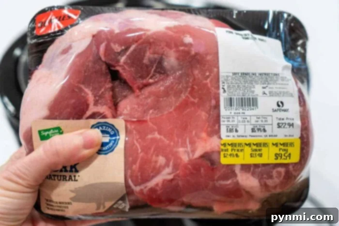 A packaged bone-in pork shoulder roast, labeled with weight and price, ready for an Instant Pot recipe.