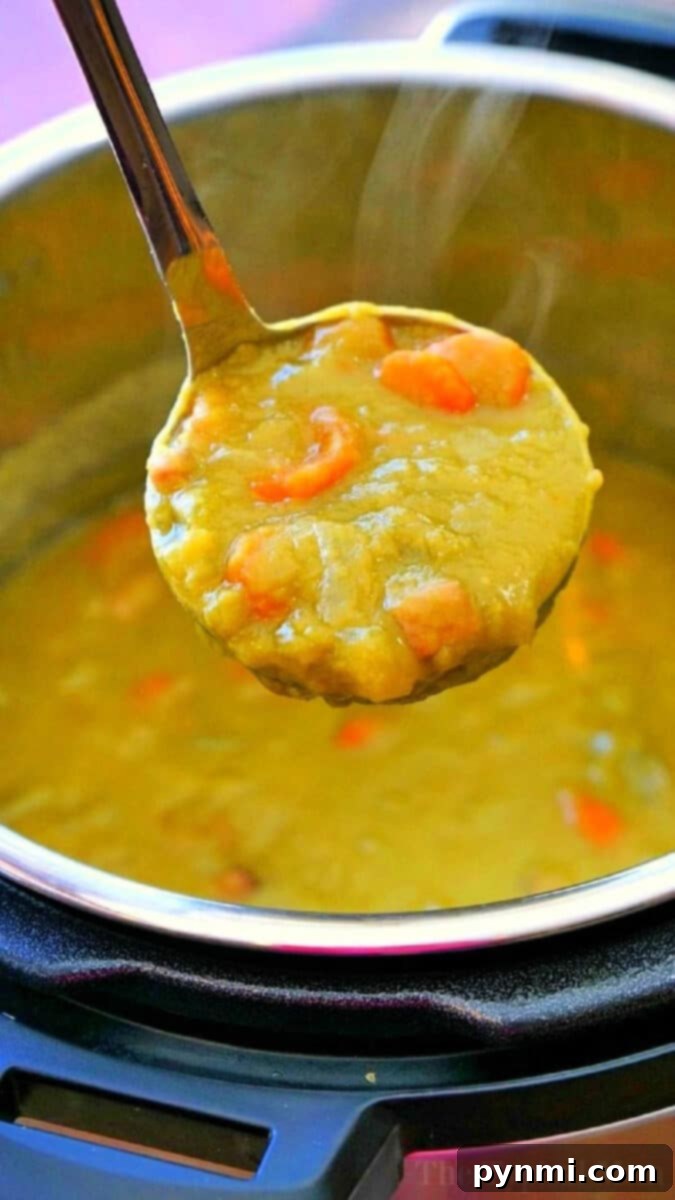 Creamy Instant Pot Split Pea Soup 7 Large pot of Instant Pot Split Pea Soup with Ham, ready to be served into bowls.