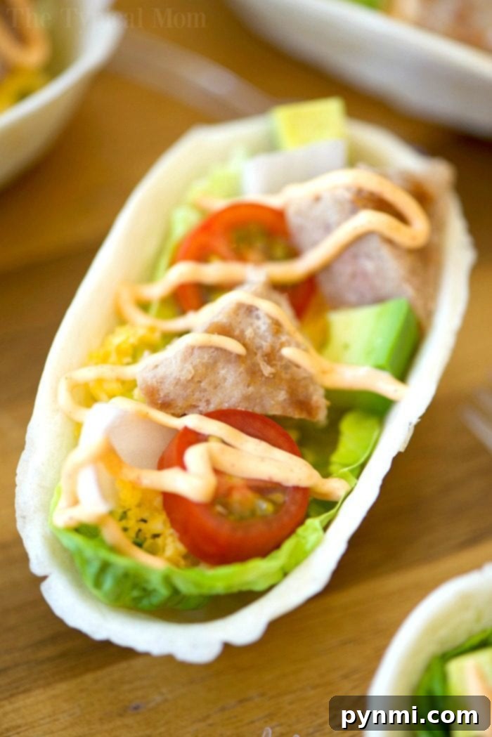 These mini turkey burger boats are the best appetizers! Packed with protein and fresh produce they are the perfect bite size for everyone, and healthy too. #appetizers #burger #groundbeef #boats #hamburger Turkey burger boats with creamy Sriracha sauce