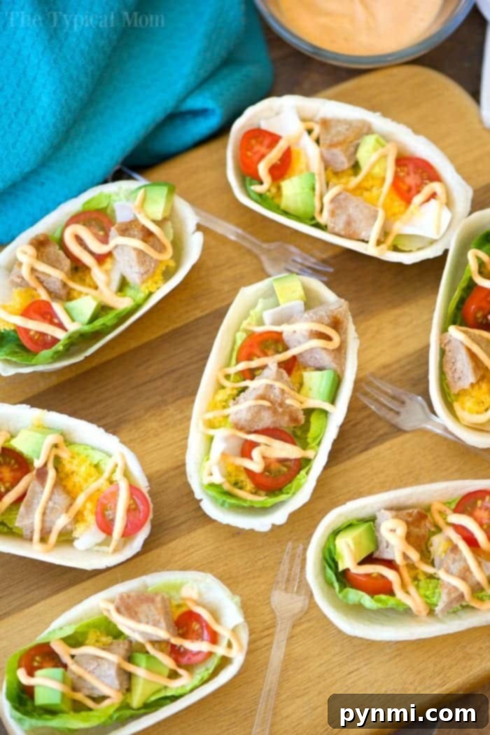 These mini turkey burger boats are the best appetizers! Packed with protein and fresh produce they are the perfect bite size for everyone, and healthy too. #appetizers #burger #groundbeef #boats #hamburger Delicious turkey burger boats ready to eat