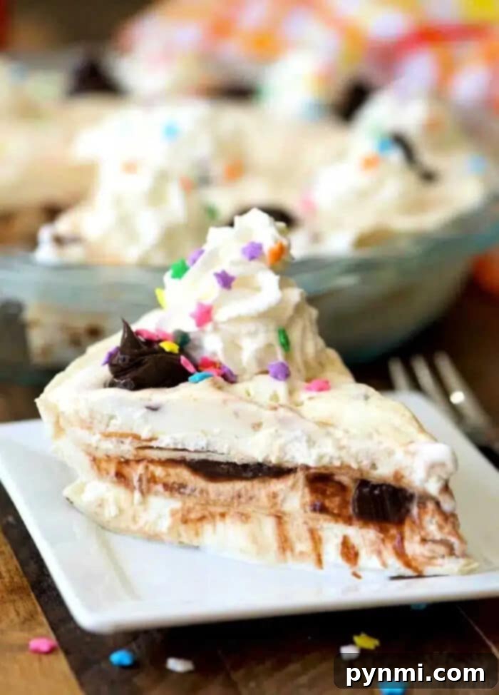 Delicious Ice Cream Sundae Pie with Hot Fudge, Whipped Cream, and Sprinkles