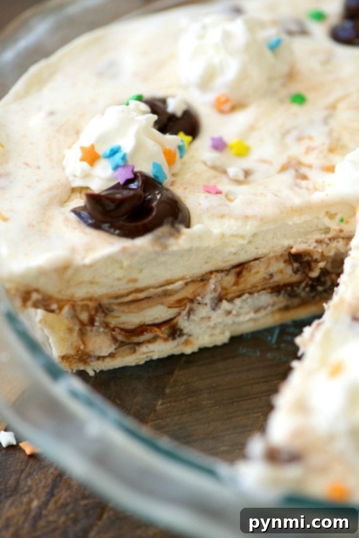 Ice Cream Sundae Pie ready for the freezer, showing fudge swirls