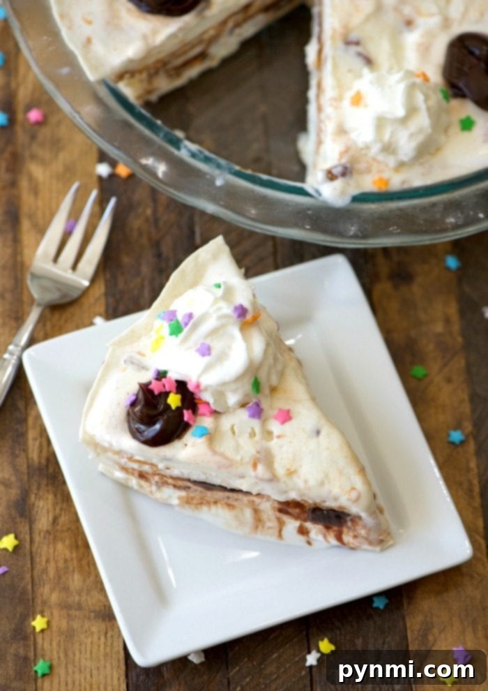 Finished Ice Cream Sundae Pie topped with whipped cream and colorful sprinkles