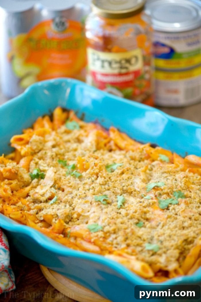 This easy chicken parmesan casserole recipe tastes great and is a great weeknight meal when you're busy! No boiling required just dump, bake, and serve! easy chicken parmesan casserole 2