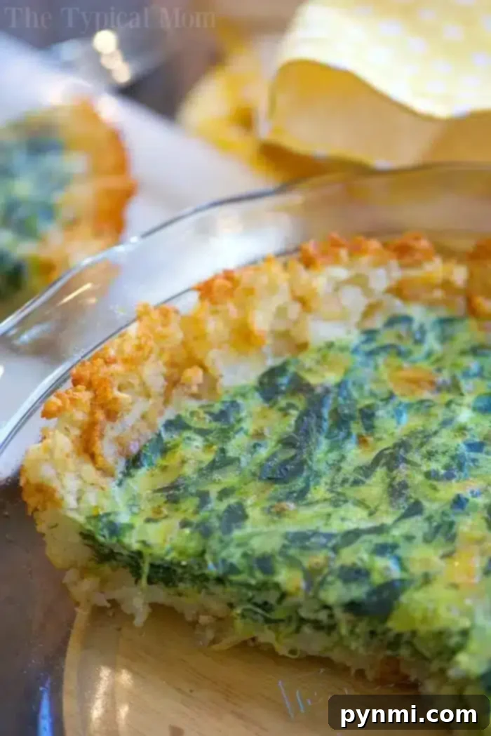 Delicious tater tot crusted spinach quiche freshly baked and ready to serve