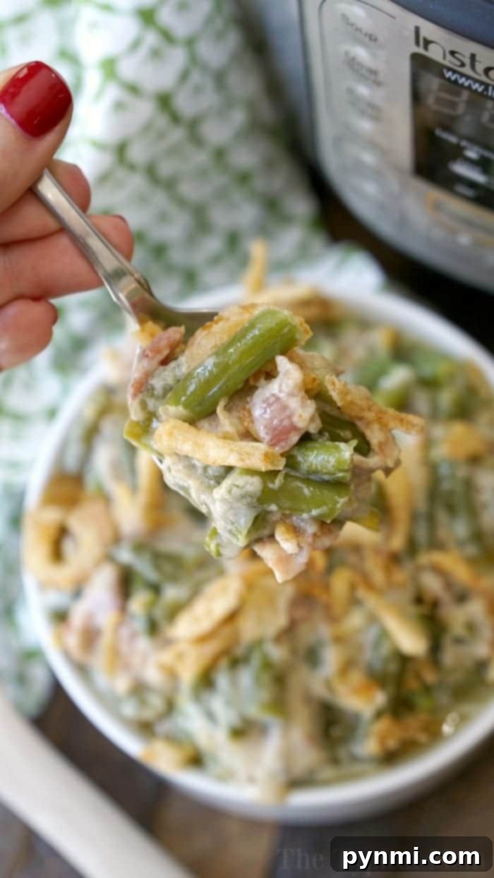Delicious Pressure Cooker Green Bean Casserole - A Flavorful Holiday Side Dish! Pressure cooker green bean casserole with crispy bacon and fried onions, ready to serve.