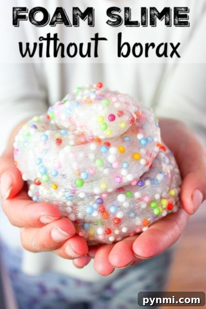 Child stretching borax free slime - fun DIY activity