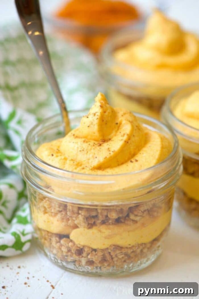If you love making desserts with your kids you've got to try this no bake pumpkin cheesecake in mason jars treats! Perfect flavors for Fall or year round. no-bake-pumpkin-cheesecake