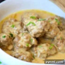 A bowl of easy homemade Swedish meatballs in creamy sauce, garnished with chopped chives, makes for a delightful dish effortlessly crafted in your Instant Pot.
