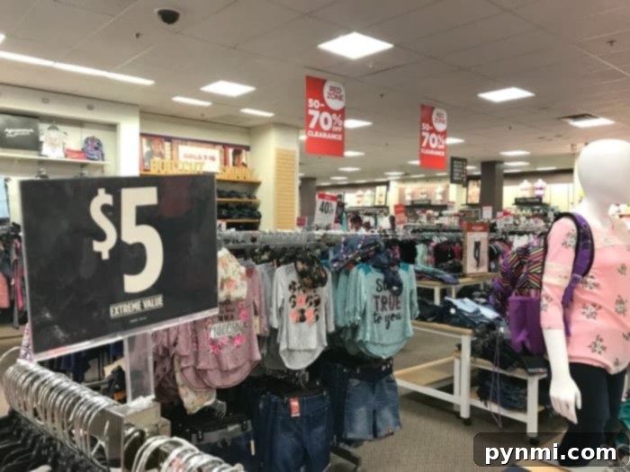 A vibrant selection of conservative clothing for girls, including dresses, skirts, and tops in various colors and patterns, displayed in a store.