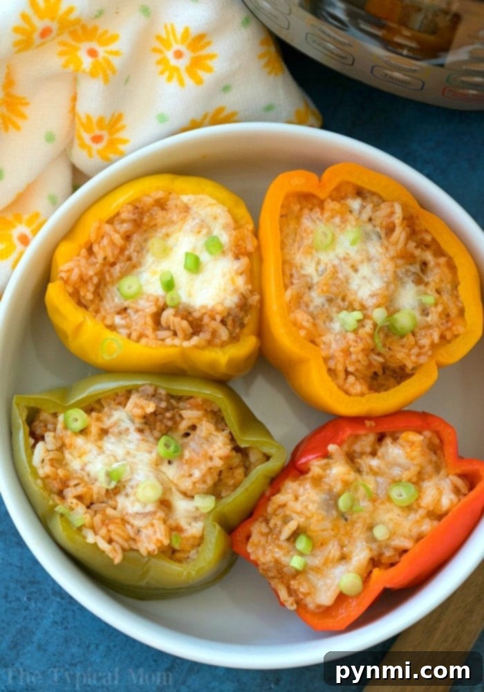Effortless Instant Pot Stuffed Peppers 2 Easy Instant Pot stuffed bell peppers – savory ground beef and rice filling inside tender bell peppers.