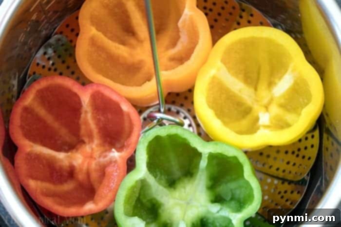 Effortless Instant Pot Stuffed Peppers 5 Steamer basket with a hook, perfect for safely lifting hot items from the Instant Pot.