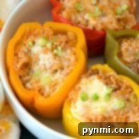 Easy Instant Pot stuffed peppers with cheesy ground beef and rice.