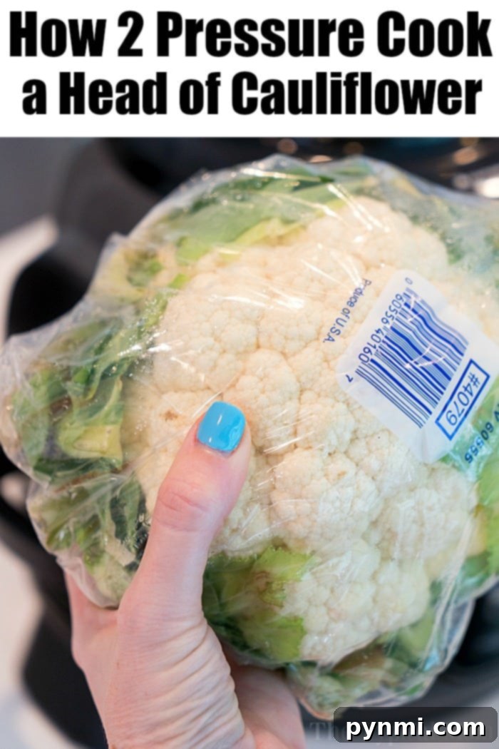 Pressure cooked cauliflower florets in a steamer basket.