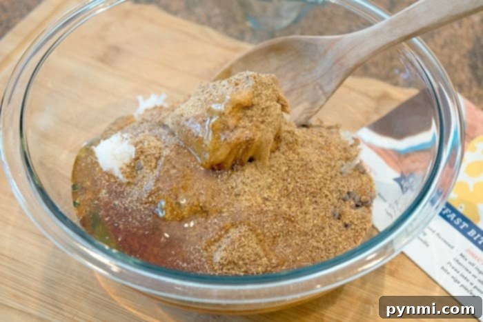 The process of making easy homemade granola bars, showing ingredients being mixed thoroughly in a large bowl