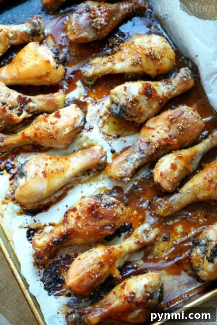 Baked teriyaki chicken drumsticks with an easy homemade sweet and spicy sauce you'll love! Moist chicken legs cooked in the oven in just about an hour. #baked #teriyaki #chicken #drumsticks #legs teriyaki chicken drumsticks 2
