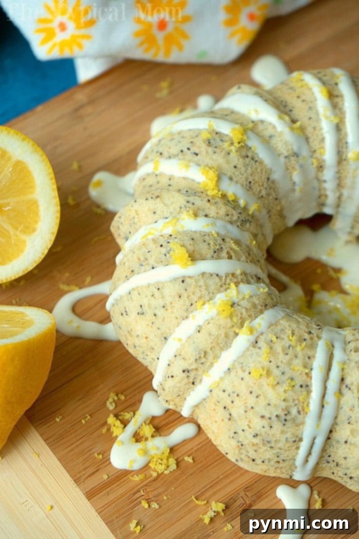 A perfectly baked Instant Pot lemon poppy seed cake, garnished with fresh lemon slices and zest, ready to be enjoyed.
