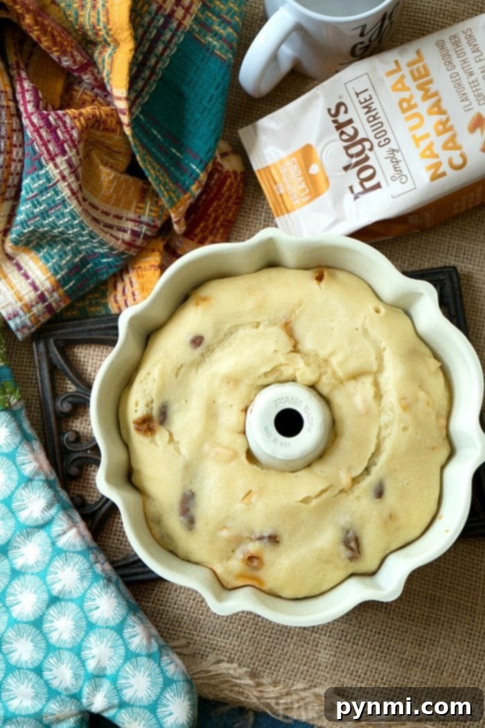 Instant Pot coffee cake is amazing! Bake it in the oven or in your pressure cooker with some coffee for the perfect breakfast. Caramel coffee cake comes out moist with all of the flavors locked in and I love it so I can bake during the summertime and not heat my house up! #coffeecake #instanntpot #pressurecooker #breakfast #instantpotrecipes #thetypicalmom #caramel #cake caramel apple pecan instant pot coffee cake