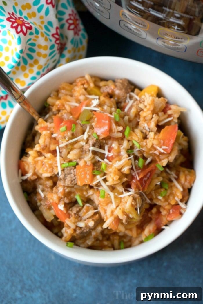 Instant Pot stuffed pepper casserole with ground beef and rice, ready to serve.