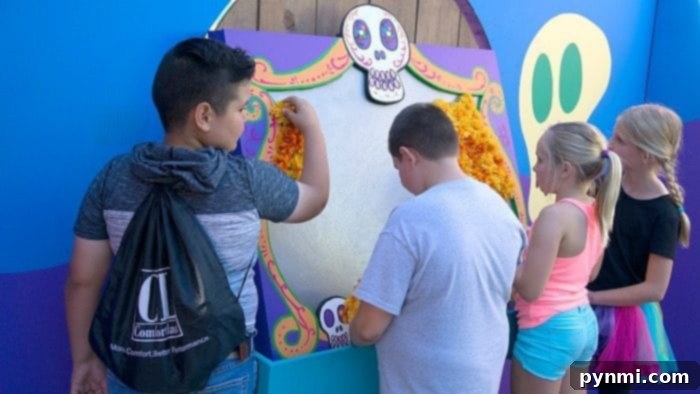 Child interacting with a snake at Knott's Berry Farm Spooky Farm