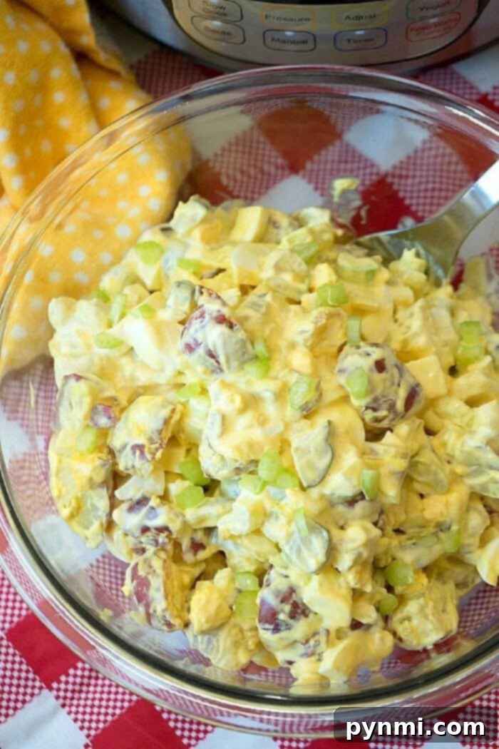 Instant Pot potato salad in just 5 minutes! Loaded with eggs and pickles it's the perfect side dish to any meal. #instantpot #pressurecooker #potatosalad #salad #potato #sidedish #easy Instant Pot Potato Salad