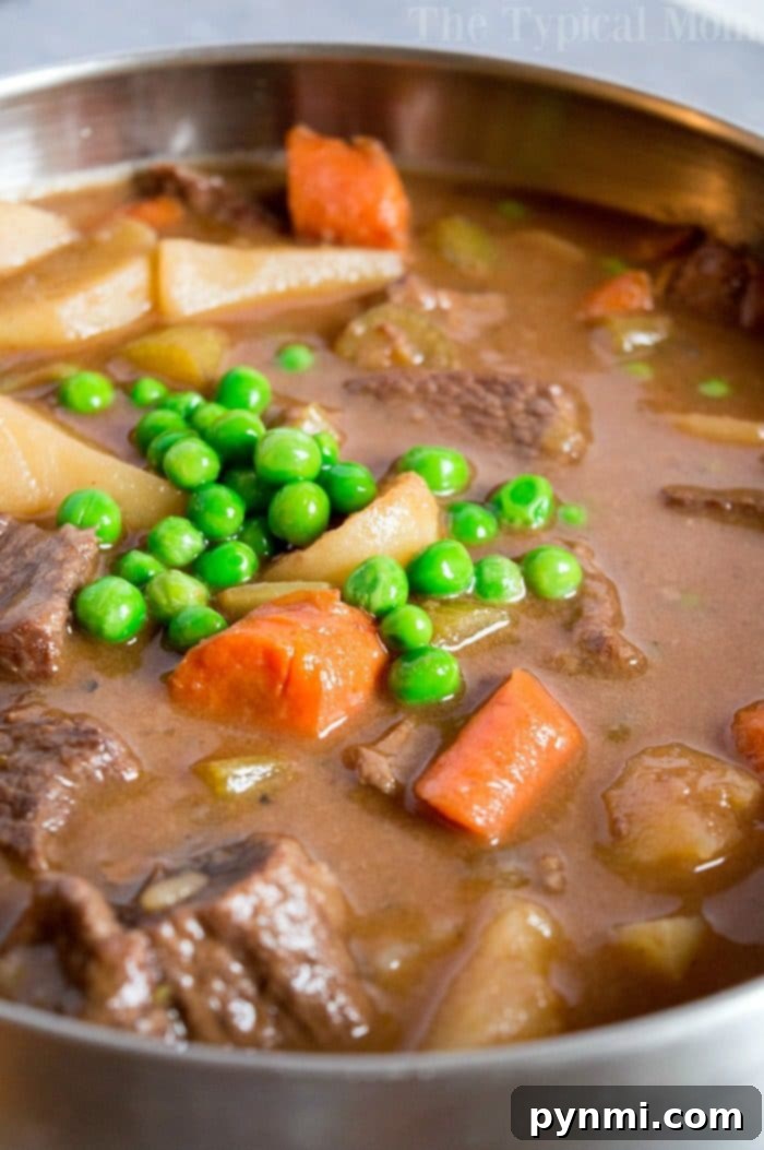 Easy slow cooker beef stew recipe you can make in your crockpot or stovetop too. Tender beef loaded with vegetables and a flavorful sauce too. #crockpot #beefstew Hearty Easy Slow Cooker Beef Stew Recipe with carrots and potatoes
