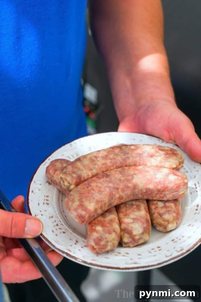 Juicy Instant Pot Brats 2 Brats arranged neatly in a steamer basket inside an Instant Pot, ready for cooking