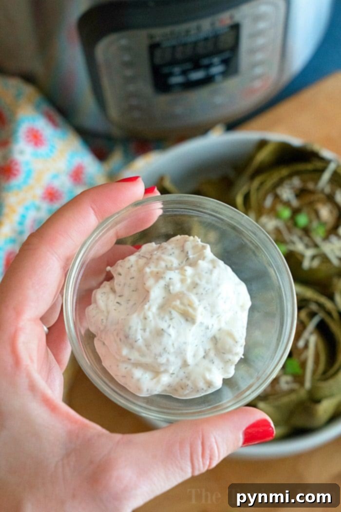 Easy Instant Pot artichokes with creamy dill dipping sauce ready in less than 15 minutes! How to steam artichokes in your pressure cooker to perfection. Our favorite vegetable for dinner and a healthy side dish too. #instantpot #pressurecooker #vegetables #artichokes #artichoke #instantpotrecipes #thetypicalmom #vegetarian Easy Instant Pot Artichokes 5