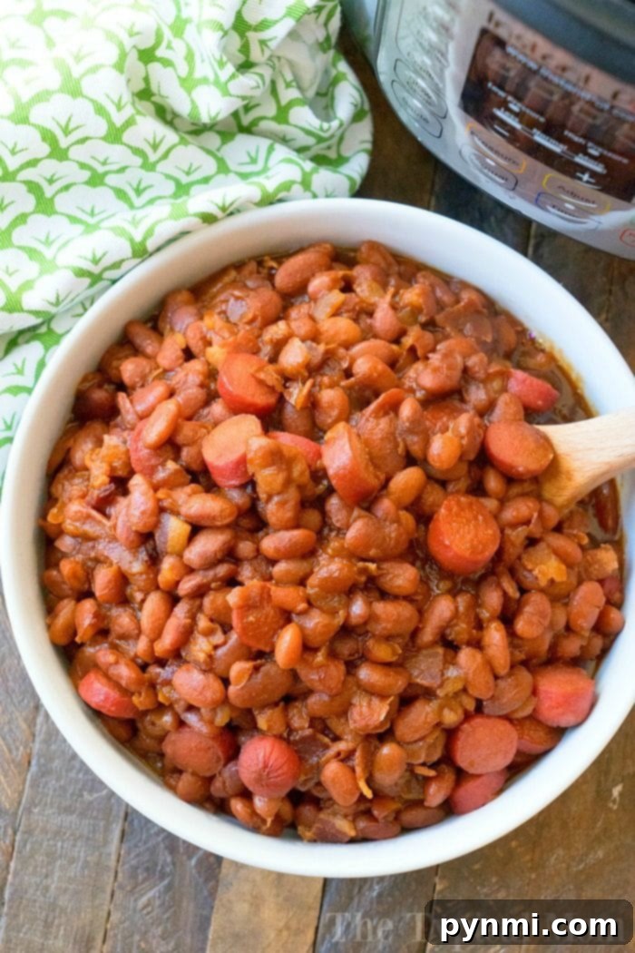 Close-up of hearty Instant Pot Beans and Franks, featuring tender beans, sliced hot dogs, and a rich, sweet sauce