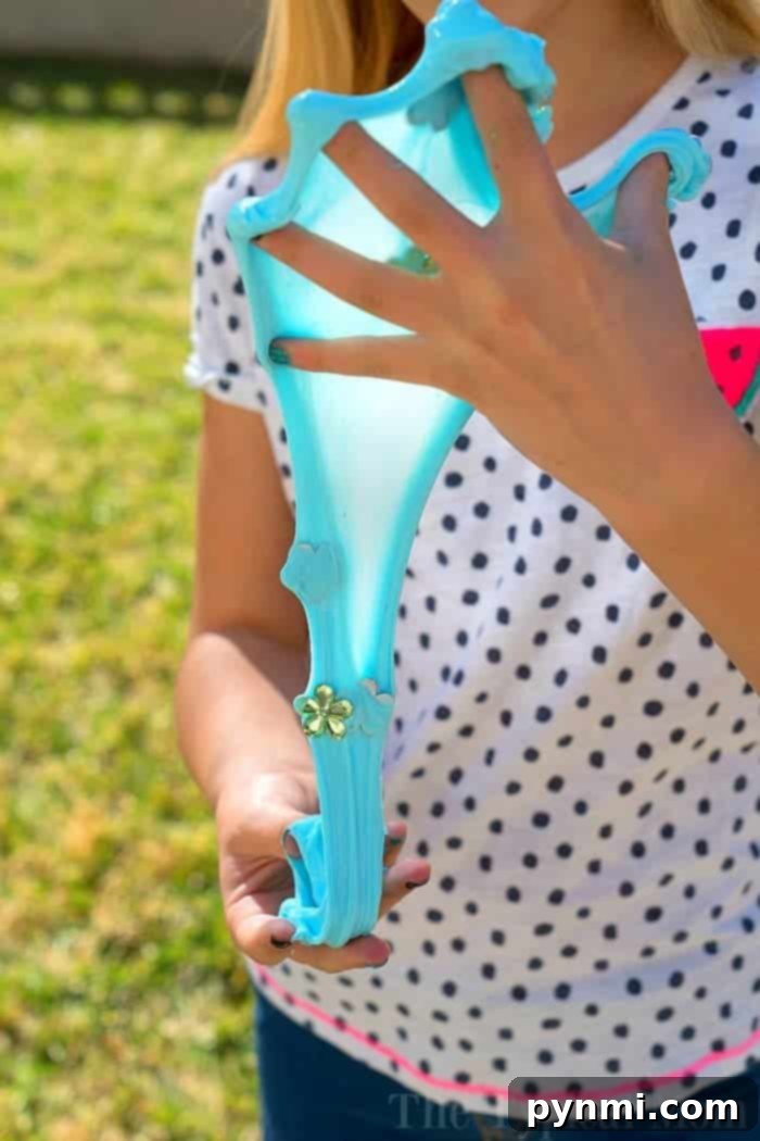 Here's a super soft slime recipe your kids will love! Ooey gooey slime that is easy to make and you just need a few household items to create some. Add any color you like and hide fun treasures inside too. #slime #soft #super #easy #recipe slime no borax