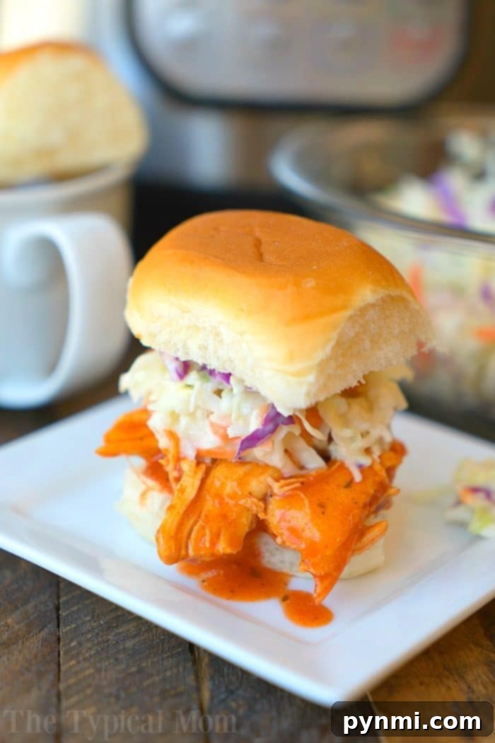 Delicious spicy electric pressure cooker buffalo chicken sliders ready to serve.